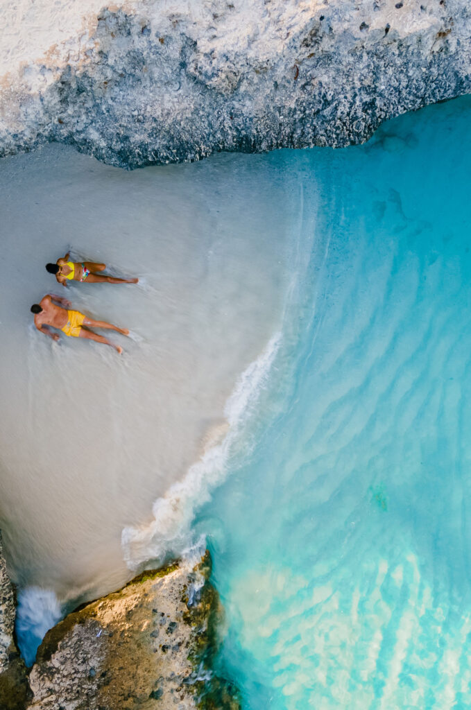a couple of men and women on the beach of Tres Trap Aruba Caribbean Island
